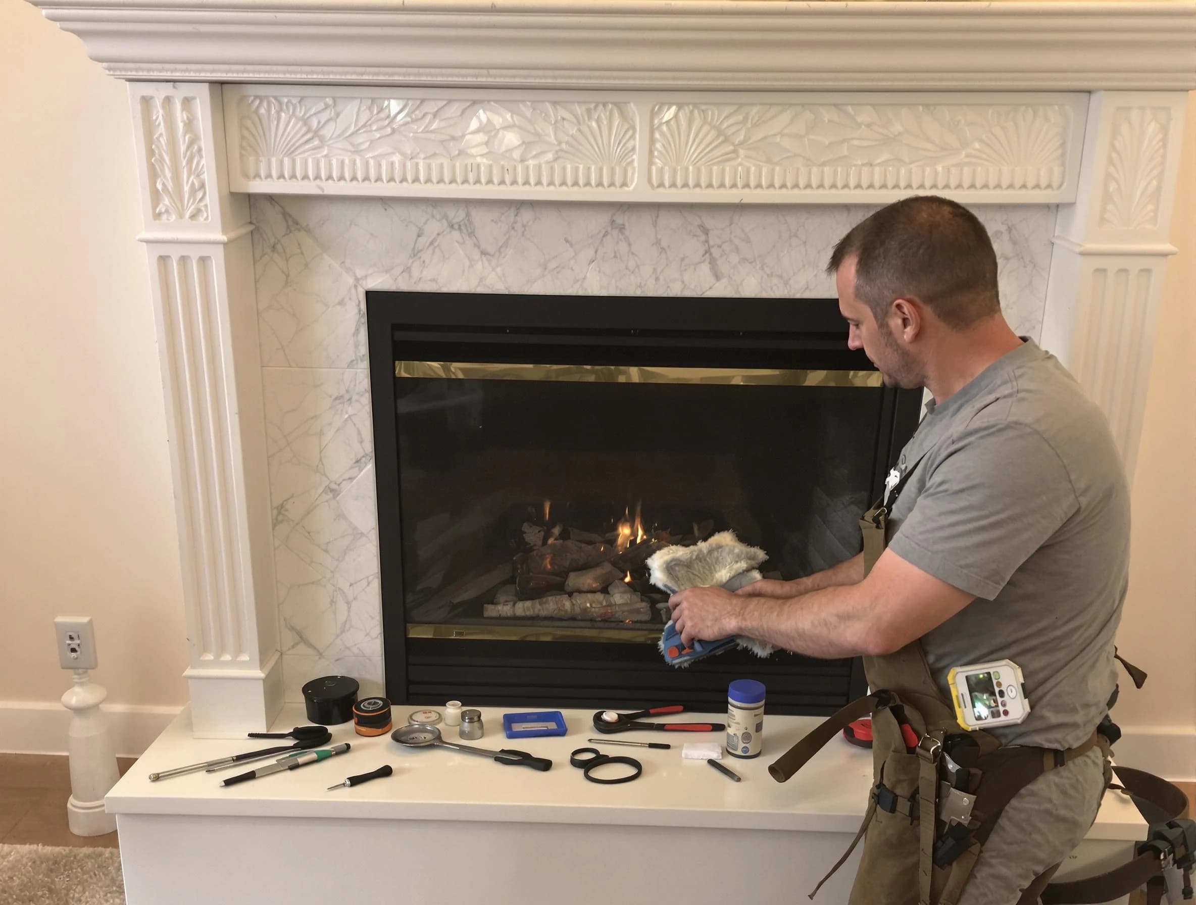Leominster Chimney Sweep performing fireplace maintenance in Leominster, MA